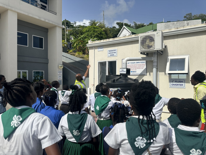 NAWASA’s Dexter Clyne discussing the components of a RWH system with 4-H students from 2 primary schools