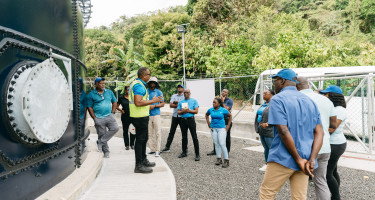 Study tour participants next to Tufton Hall tank in Grenada
