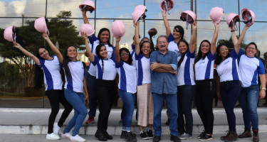 Group of 19 people participating in the workshop poses in front of PEEB Cool slides 
